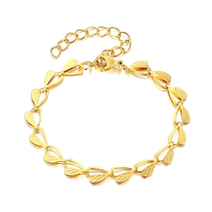Polished gold heart-shaped link bracelet with textured leaf details and lobster clasp