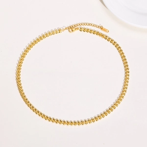 Detail of gold wheat chain necklace with 18K hallmark and lobster clasp closure