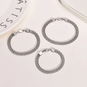 Detail of silver mesh bracelet set with stainless steel weave and lobster clasps