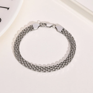 Detailed view of silver multi-layer stainless steel mesh chain bracelet with lobster clasp