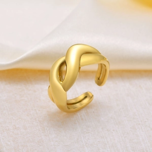 Elegant gold-tone twisted knot open ring with a matte finish on a silk background