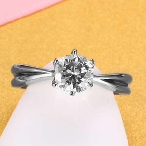 Classic six-prong round diamond ring with elegant twisted band in polished white metal