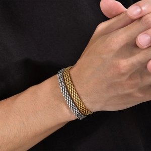 Mesh chain bracelet in gold and silver stainless steel for men and women worn on wrists