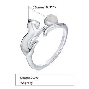 Adjustable copper cat ring with a round moonstone set in a polished silver finish