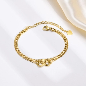 Bracciale a doppio strato in acciaio dorato con simbolo infinito e cuore pendente