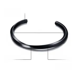 Macro detail of 4mm black IP plated stainless steel twisted bangle with high polish finish