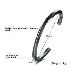 Detail of vintage twisted stainless steel open bangle with 59mm diameter and 4mm width
