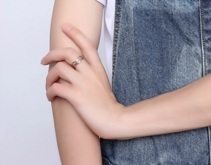 Detailed view of multilayer stainless steel ring with gold and silver woven texture