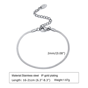 Detailed close-up of stainless steel snake chain bracelet with K18 tag and lobster clasp