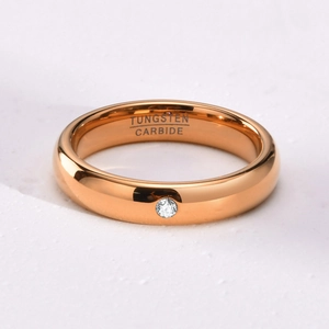 Macro shot of 4mm rose gold tungsten carbide ring with a single sparkling cubic zirconia