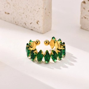 Macro detail of gold-plated open ring featuring marquise-cut green zircon stones