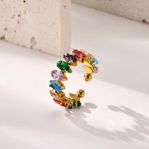 Macro detail of gold open ring featuring a row of vibrant marquise-cut rainbow zircons