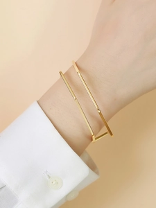 Minimalist gold geometric C-shaped open bracelet in double-layered parallel square design