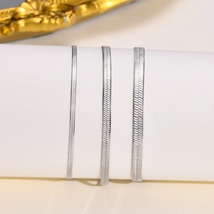 Detailed comparison of three silver herringbone snake chains in various widths and textures