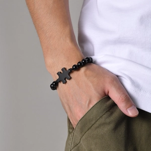 Adjustable black onyx bead bracelet for men with polished stainless steel puzzle charm