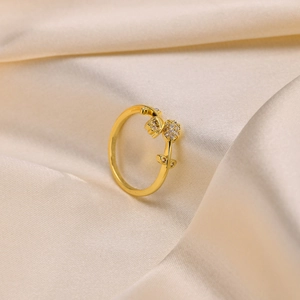 Detail of tulip branch ring in 18K gold finish with sparkling white zircon flowers