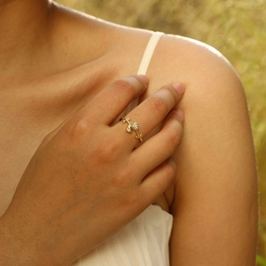Detailed close-up of tulip flower ring with gold plating and sparkling micro-inlaid stones