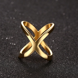 Polished gold X-shape ring featuring a minimalist cross design on a sleek black background