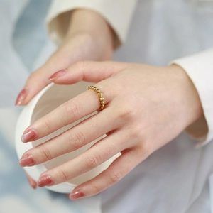 Minimalist golden beaded ring for women featuring polished round spheres in a sleek design