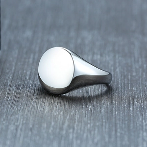 Macro shot of mirror-polished stainless steel signet ring with a blank round surface