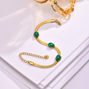 Gold herringbone chain bracelet with three oval green zircon stones and adjustable lobster clasp