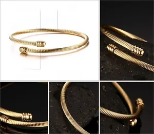 Macro detail of 3mm gold-plated stainless steel cable bracelet with polished finish