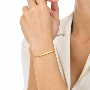 Minimalist adjustable gold chain bracelet with a polished rectangular bar shown on a wrist