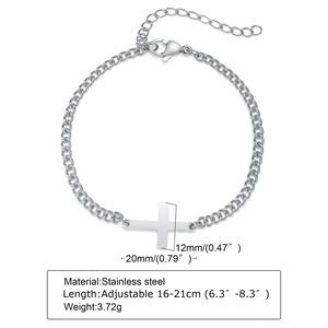 Detail of cross charm on stainless steel cable chain bracelet with adjustable size labels