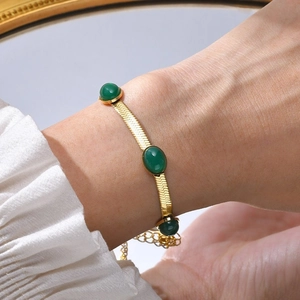 Gold stainless steel flat snake chain bracelet with three green oval zircon stones