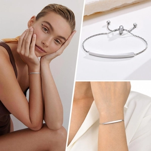 Macro detail of adjustable stainless steel bar bracelet with smooth polished finish