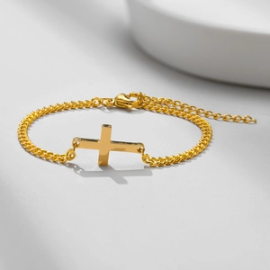 Polished gold cross bracelet with fine link chain and adjustable lobster clasp closure