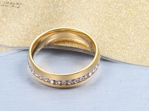 Macro shot of gold-plated stainless steel ring with micro-paved white zircon crystals