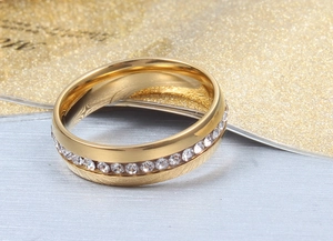 Macro shot of gold-plated stainless steel ring with micro-paved crystal zircons