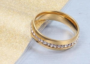 Macro shot of gold-plated titanium ring featuring a full circle of pavé set crystal zircons