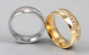 Detailed view of silver and gold titanium rings featuring crystal zircon pavé setting