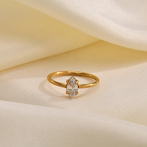 Detailed view of a gold-finish ring featuring a marquise-cut marquise zircon stone