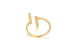 Macro shot of minimalist gold open ring with vertical parallel bars and brushed metal texture