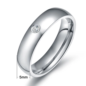 Detail of 5mm polished titanium steel ring featuring a single round cubic zirconia stone