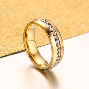Polished titanium steel gold-plated ring featuring an elegant row of clear cubic zirconia