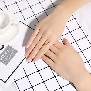 Minimalist gold open ring featuring double vertical bars on a polished stainless steel band
