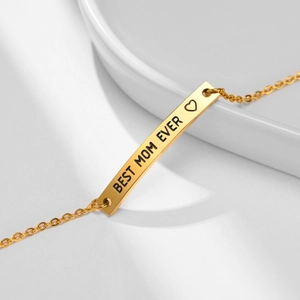 Detail of gold stainless steel bar bracelet with Best Mom Ever heart engraving