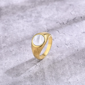 Golden stainless steel signet ring for women featuring a round white mother of pearl inlay