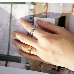 Minimalist stainless steel layered rings in gold and silver with frosted finish texture