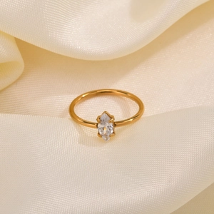 Elegant 18K gold stainless steel ring with marquise-cut marquise stone on cream silk