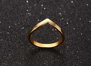 Macro shot of V-shaped 18K gold-plated titanium ring with high mirror polish finish