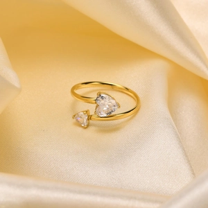 Macro shot of 18K gold plated ring featuring double heart-shaped cubic zirconia stones