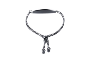 Macro view of adjustable silver box chain bracelet with rectangular polished ID tag