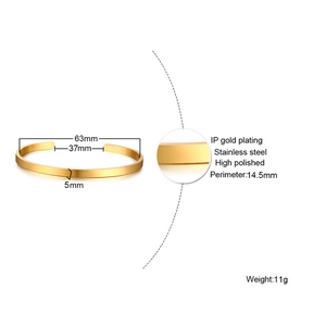 Detail of high polished gold plated stainless steel cuff bangle with size dimensions