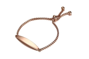 Macro detail of rose gold box chain bracelet with adjustable bead and polished curved ID tag