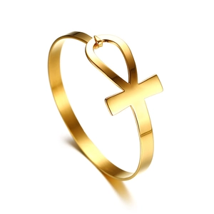 Minimalist gold stainless steel Ankh cross bangle with polished finish on white background